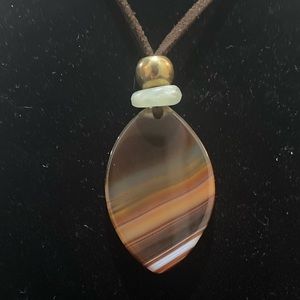 Polished stone pendant